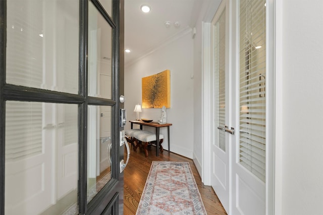 interior space featuring french doors, dark wood finished floors, baseboards, ornamental molding, and recessed lighting