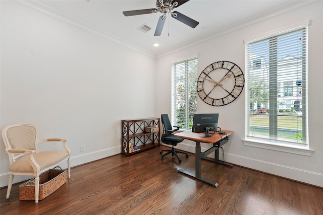 home office featuring a ceiling fan, crown molding, wood finished floors, baseboards, and visible vents