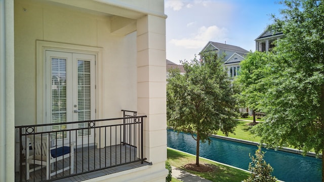 balcony featuring a water view