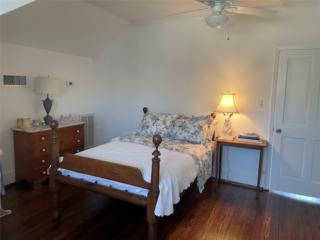 bedroom featuring ceiling fan, visible vents, lofted ceiling, and wood finished floors