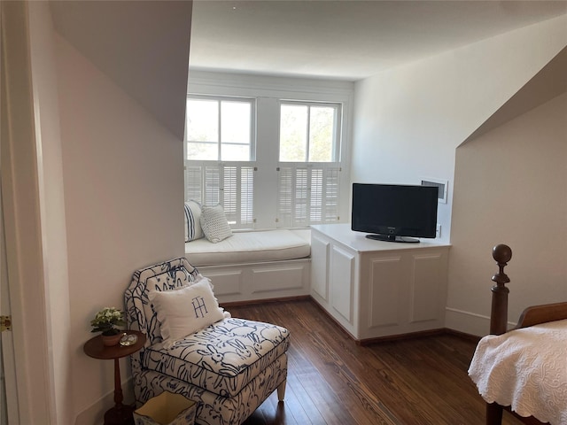 bedroom with baseboards and dark wood-style flooring