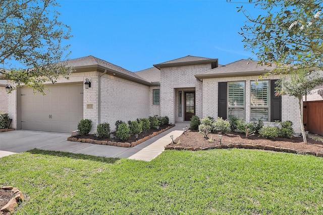 122 S Wild Petunia Trl, Montgomery, TX 77316 - view of front facade featuring brick siding, a garage, a front yard, concrete driveway, and a shingled roof