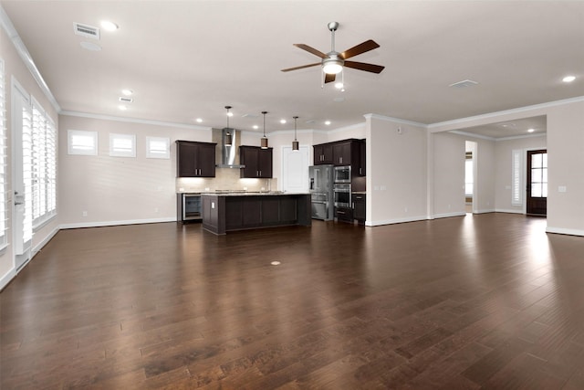 122 S Wild Petunia Trl, Montgomery, TX 77316 - unfurnished living room featuring beverage cooler, ceiling fan, dark wood-style floors, baseboards, and recessed lighting