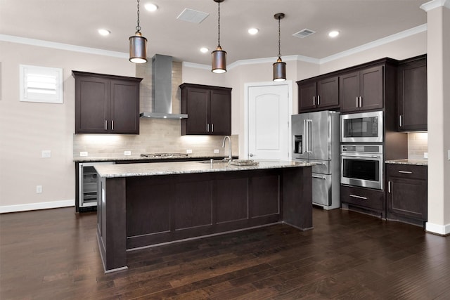 122 S Wild Petunia Trl, Montgomery, TX 77316 - kitchen with appliances with stainless steel finishes, wall chimney range hood, a sink, backsplash, and dark brown cabinets