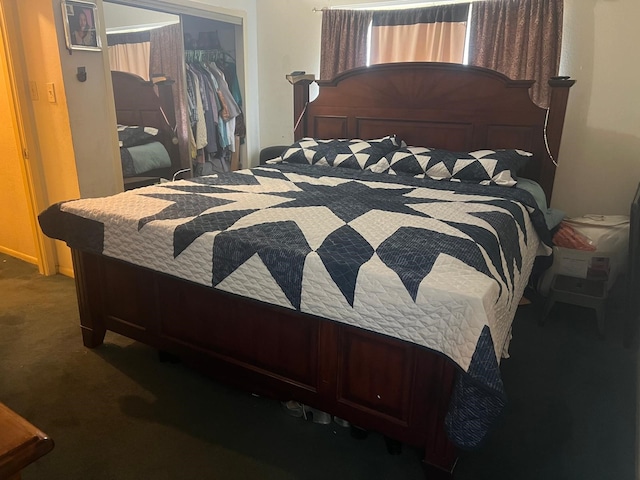 carpeted bedroom featuring a closet