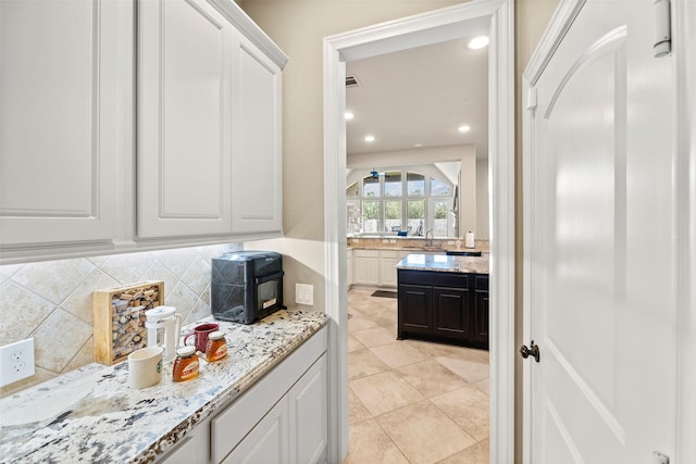 30614 Indigo Falls Dr, Brookshire, TX 77423 - bar with backsplash, recessed lighting, light tile patterned flooring, and a sink