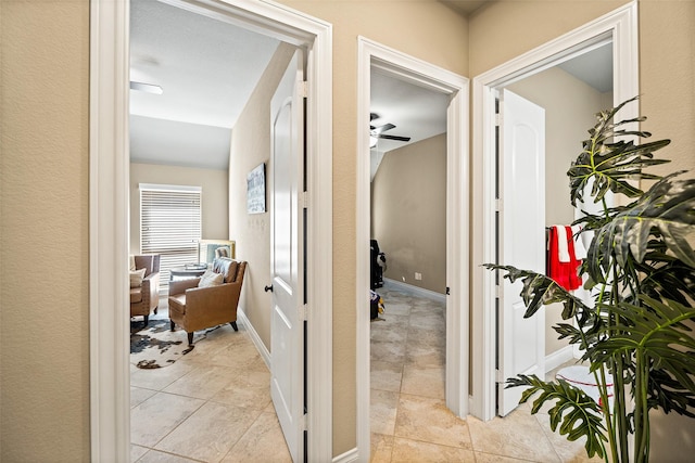 30614 Indigo Falls Dr, Brookshire, TX 77423 - hallway with light tile patterned floors and baseboards