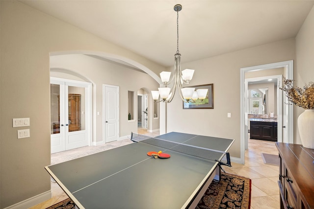 30614 Indigo Falls Dr, Brookshire, TX 77423 - rec room featuring light tile patterned floors, french doors, baseboards, arched walkways, and a chandelier