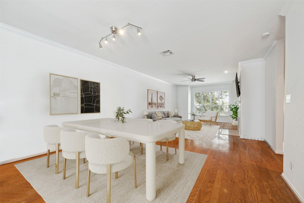 2907 La Branch St, Houston, TX 77004 - dining room with visible vents, wood finished floors, baseboards, and ornamental molding