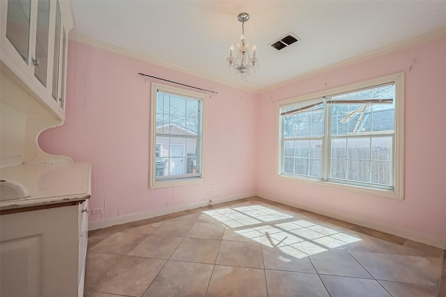 unfurnished dining area featuring visible vents, an inviting chandelier, ornamental molding, and a healthy amount of sunlight