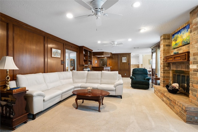 living room featuring a ceiling fan, recessed lighting, and light carpet