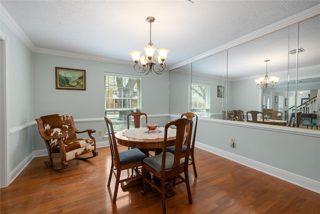 dining area with an inviting chandelier, plenty of natural light, and wood-type flooring