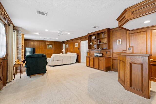 living area featuring ceiling fan, light colored carpet, recessed lighting, and visible vents