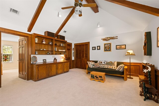 living room with visible vents, light carpet, beamed ceiling, high vaulted ceiling, and a ceiling fan