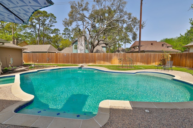view of pool featuring a fenced in pool, a diving board, and a fenced backyard