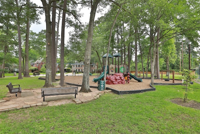 communal playground featuring a yard