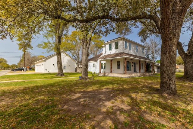 525 Hardeman St, Sealy, TX 77474 - view of front of home featuring driveway, a garage, covered porch, and a front yard