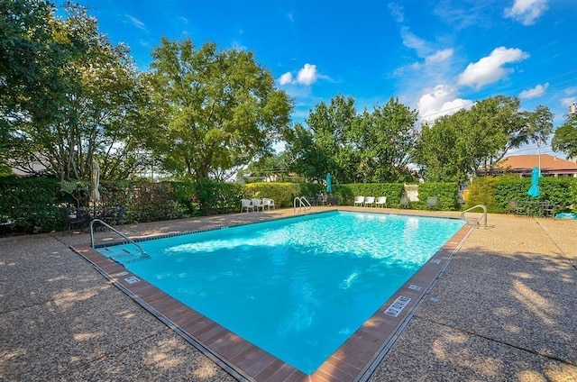 7520 Hornwood Dr Unit 1406, Houston, TX 77036 - pool with fence and a patio area