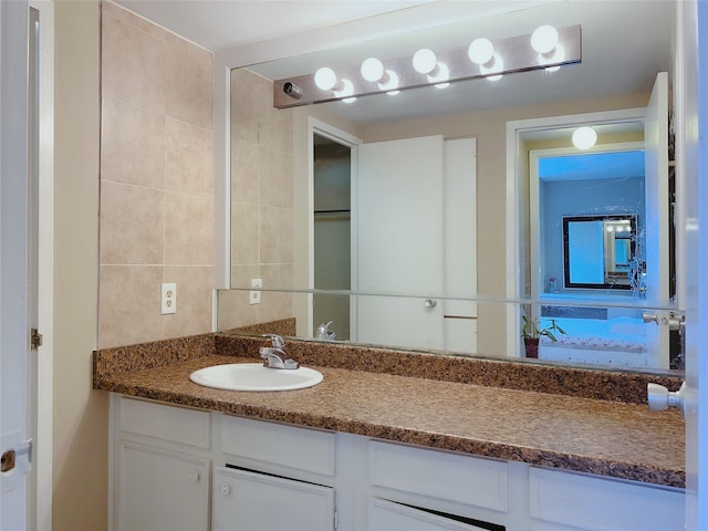 7520 Hornwood Dr Unit 1406, Houston, TX 77036 - bathroom featuring tile walls and vanity