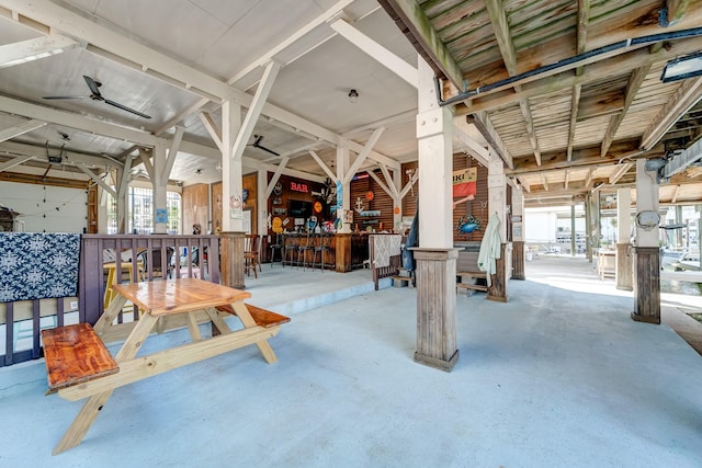 miscellaneous room with a workshop area and unfinished concrete floors