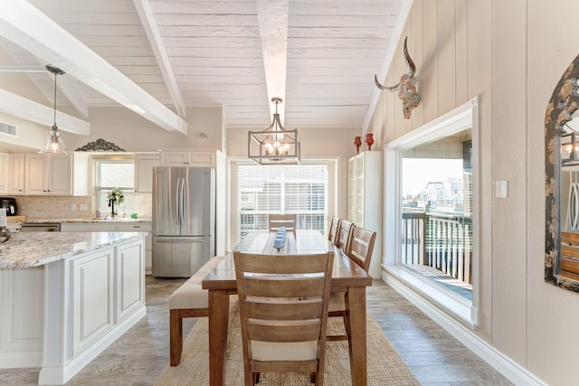 dining space featuring visible vents, wood ceiling, lofted ceiling with beams, light wood-style flooring, and a notable chandelier