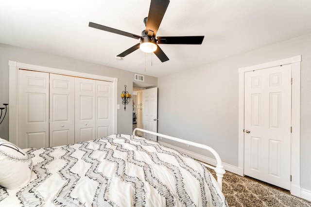 bedroom featuring a closet, visible vents, a ceiling fan, and baseboards