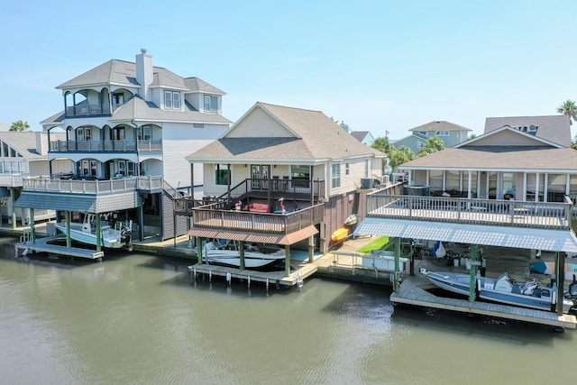 view of dock featuring boat lift and a water view