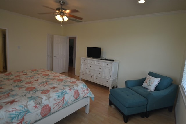 4031 Hardin Dr, Galveston, TX 77554 - bedroom with visible vents, ceiling fan, ornamental molding, and light wood-style flooring