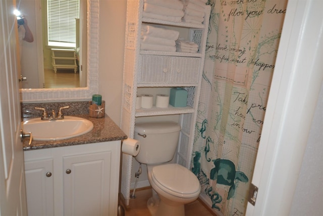 4031 Hardin Dr, Galveston, TX 77554 - full bathroom with curtained shower, vanity, and toilet