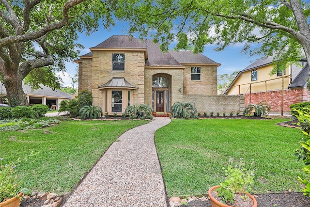 20031 Pine Wind Dr, Humble, TX 77346 - traditional-style home with brick siding and a shingled roof