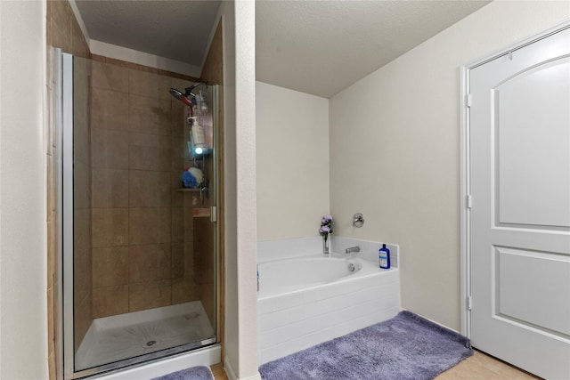 full bathroom with a garden tub and a stall shower