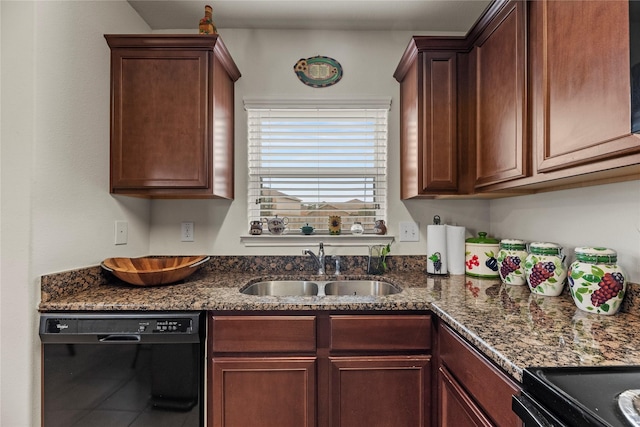 kitchen featuring a sink, dark stone counters, and black appliances