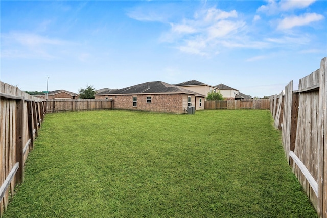 view of yard featuring a fenced backyard