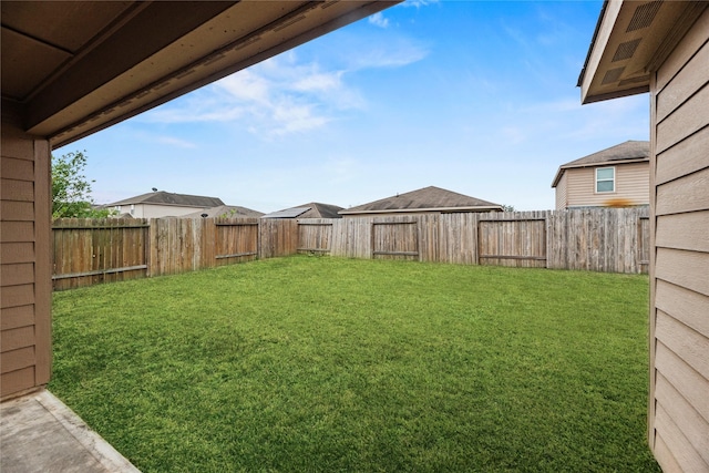 view of yard with a fenced backyard