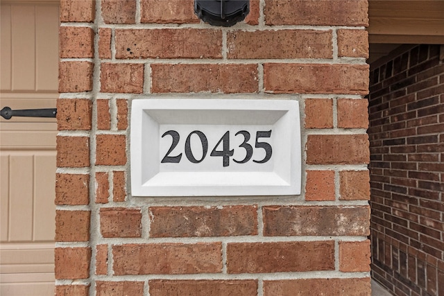 exterior details featuring brick siding