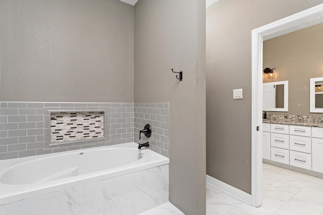 446 Piney Point Dr, Sour Lake, TX 77659 - full bathroom with baseboards, marble finish floor, vanity, and a garden tub