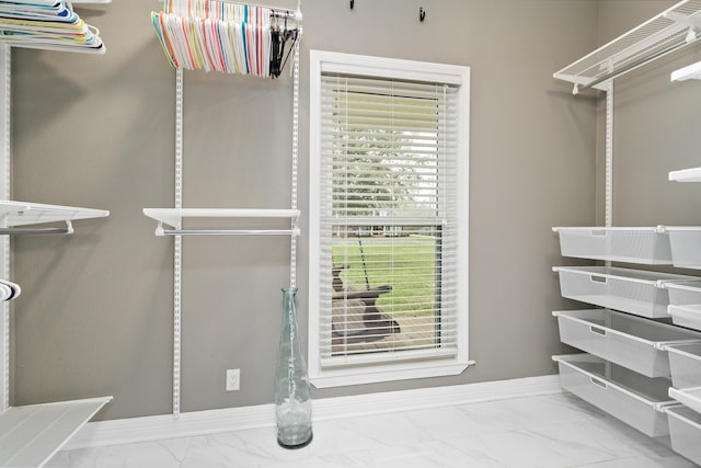 446 Piney Point Dr, Sour Lake, TX 77659 - walk in closet featuring marble finish floor