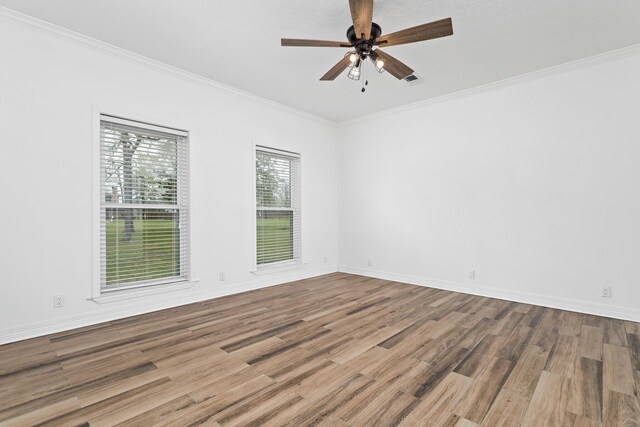 446 Piney Point Dr, Sour Lake, TX 77659 - empty room featuring ceiling fan, crown molding, baseboards, and wood finished floors