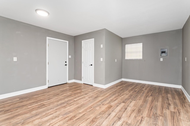 446 Piney Point Dr, Sour Lake, TX 77659 - spare room with baseboards and light wood-style floors
