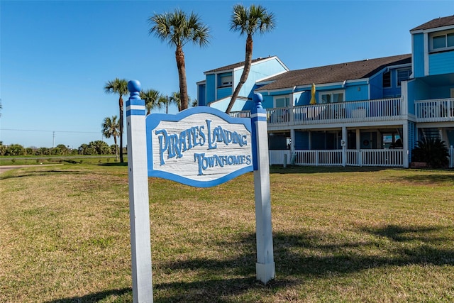908 Calico Jack Cv, Galveston, TX 77554 - community sign with a yard