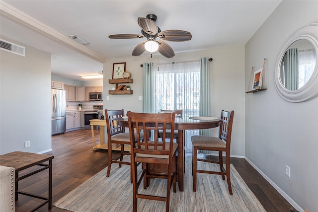 908 Calico Jack Cv, Galveston, TX 77554 - dining room with a ceiling fan, wood finished floors, and baseboards