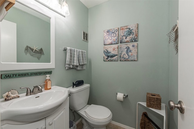 908 Calico Jack Cv, Galveston, TX 77554 - bathroom with toilet, vanity, and baseboards