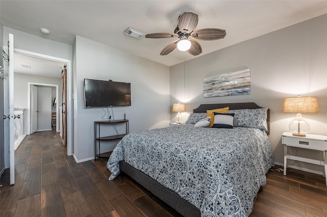 908 Calico Jack Cv, Galveston, TX 77554 - bedroom with wood finished floors, baseboards, and a ceiling fan