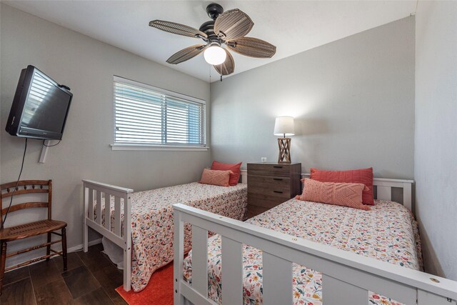 908 Calico Jack Cv, Galveston, TX 77554 - bedroom featuring wood finished floors, baseboards, and a ceiling fan
