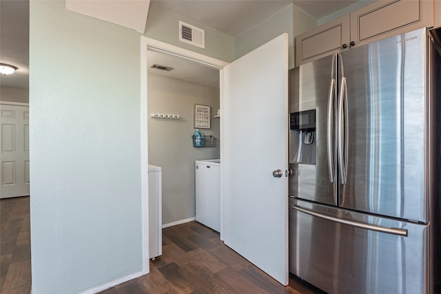 908 Calico Jack Cv, Galveston, TX 77554 - kitchen featuring stainless steel refrigerator with ice dispenser, independent washer and dryer, dark wood-style floors, and gray cabinetry