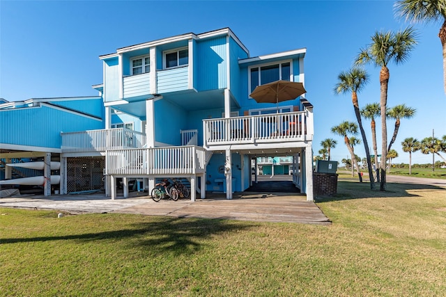 908 Calico Jack Cv, Galveston, TX 77554 - back of house with a carport and a yard