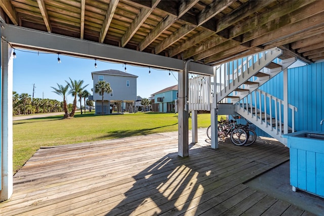 908 Calico Jack Cv, Galveston, TX 77554 - wooden deck featuring stairway and a yard