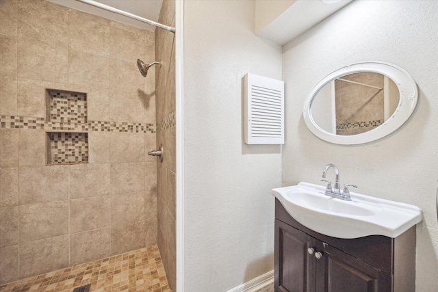 12007 Fairpoint Dr, Houston, TX 77099 - bathroom featuring a tile shower, visible vents, and vanity