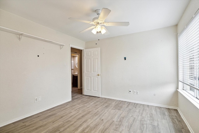 12007 Fairpoint Dr, Houston, TX 77099 - empty room featuring a ceiling fan, light wood-type flooring, and baseboards