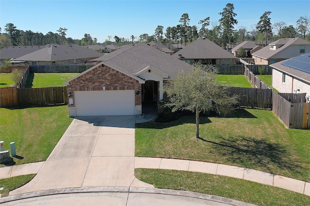 ranch-style home featuring a residential view, an attached garage, driveway, and a front yard
